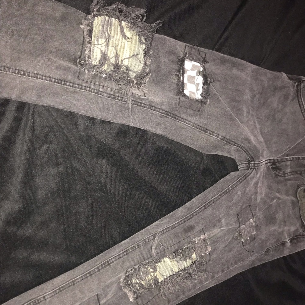 Distressed black skinny jeans